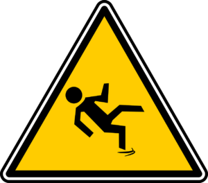 a warning sign depicting a person slipping